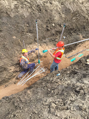 Workers in trench
